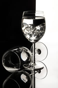 Wineglasses on glass reflecting background