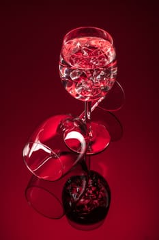 Wineglasses on glass reflecting background