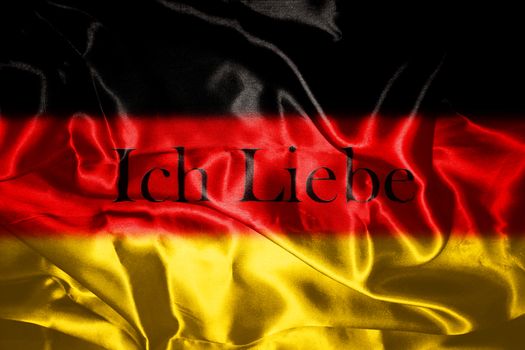 German flag blowing in the wind With Letters That Spell I Love