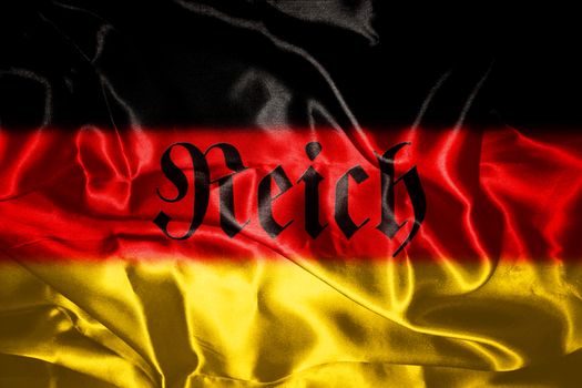 German flag blowing in the wind With Reich Written On It Which Means Realm