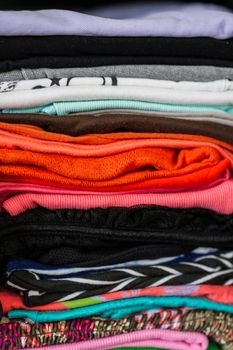 A pile of colorful clothes on white