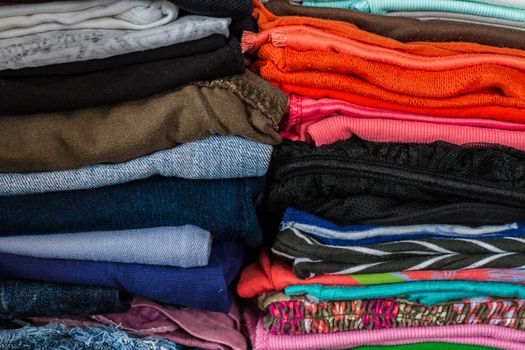 A pile of colorful clothes on white