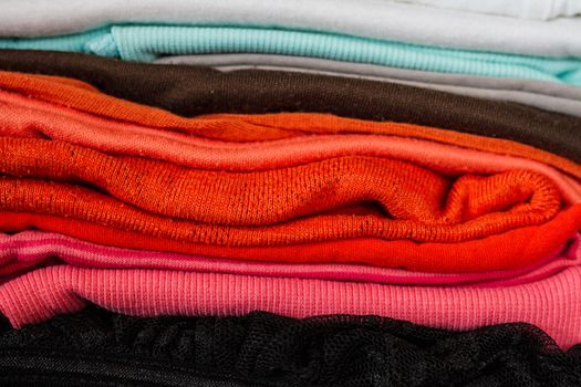 A pile of colorful clothes on white