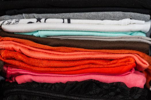 A pile of colorful clothes on white