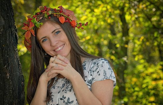 Portrait of girl with autumn wreath