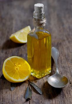  Liver Detox with olive oil and  lemon fruits on the wooden table