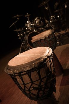 Traditional wooden african djembe drum on stage, France