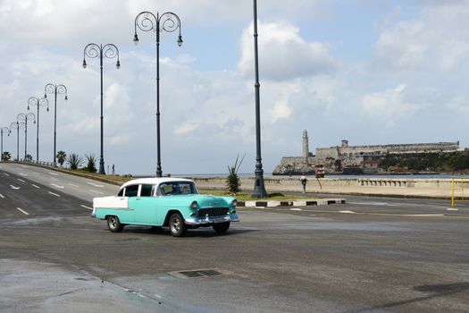 Havana, Cuba - 27 January 2016: Person driving his vintage car at the Malecon in Havana on Cuba