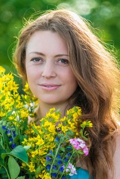 Portrait of a beautiful girl with flowers