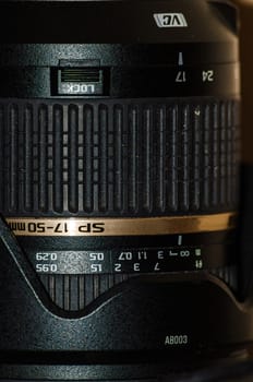 Lens for SLR camera closeup black stands upright