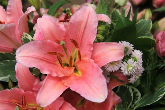 Pink tiger lily in a bridal arrangement