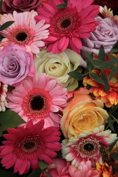 Gerberas and roses in bright colors in a bridal bouquet