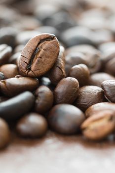 Close up heap of roasted brown coffee beans