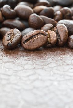 Close up heap of roasted brown coffee beans