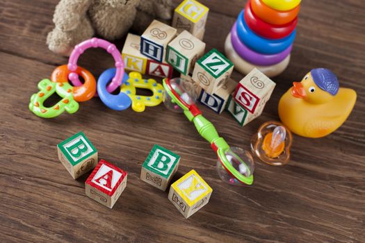 Children's World toy on a wooden background. Studio shot]