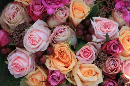 Pastel roses in different shades of pink in a bridal arrangement