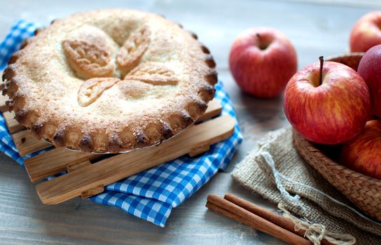 Close of an apple pie with fruit ingredients