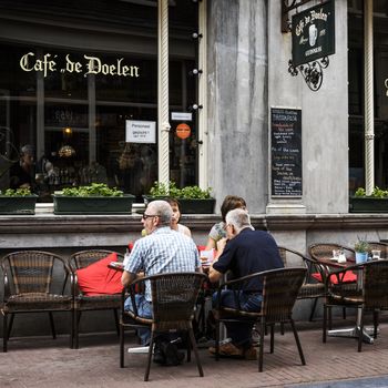 AMSTERDAM, NETHERLANDS, JULLY 9  2016.cafe de doelen in typical district of Amesterdam with people sitting on a terrace, NETHERLANDS