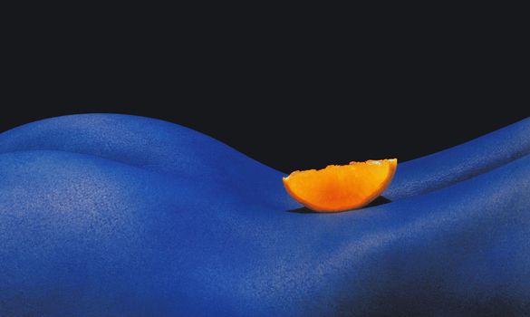 Piece of orange in blue back