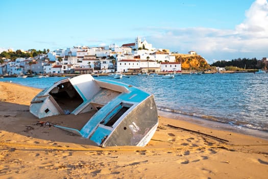 Old fisherman's boat at the beach near Ferragudo in the Algarve Portugal