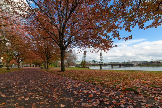Portland Oregon city downtown waterfront park by Hawthorne Bridge in fall season