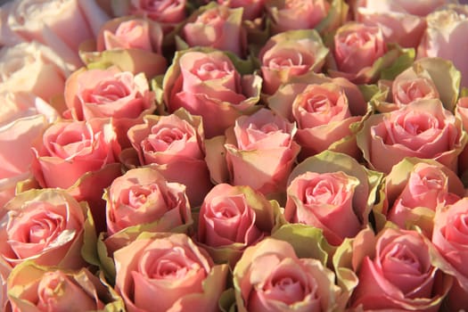 Pink roses in a floral wedding arrangement