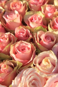 Pink roses in a floral wedding arrangement