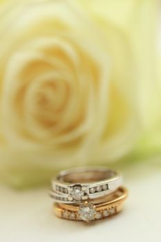 Two diamond wedding sets and ivory white rose