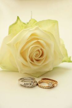 Two diamond wedding sets and ivory white rose