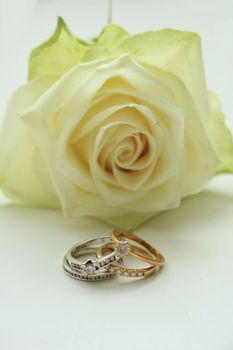 Two diamond wedding sets and ivory white rose
