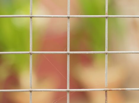 CLOSE-UP SHOT OF RUSTIC WIRE FENCE