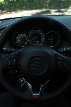 Car dashboard, luxurious materials in different shades of grey