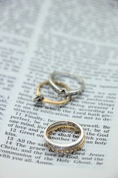 Two wedding sets, one in yellow gold, one in white gold for a double bride wedding on a bible verse