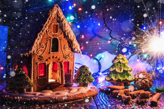 Gingerbread house with lights on dark background, xmas theme