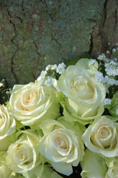 White roses in a bridal bouquet