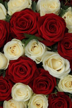 Red and whte roses in a wedding centerpiece