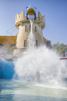 ride at a water park full tank poured on children and man