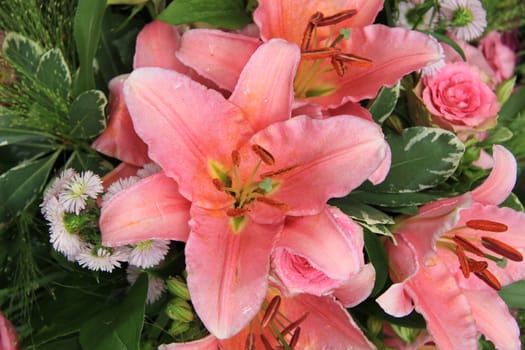 Pink tiger lily in a bridal arrangement