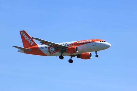 Amsterdam the Netherlands - May, 5th 2016:  G-EZDW easyJet Airbus A319-111
 approaching Schiphol Polderbaan runway, arriving from Edinburgh, United Kingdom