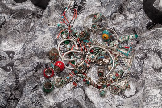 Handmade jewelry on fabric bacground in ethnic style