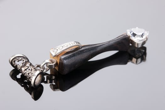 Handmade jewelry on a black glass studio background