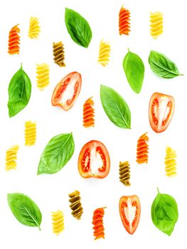 Italian food concept Fusilli pasta with tomato sliced and sweet basil leaves isolate on white background. Pasta and ingredients for foods background and menu design with flat lay .