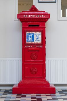 Retro dutch red mail box in a post offfice