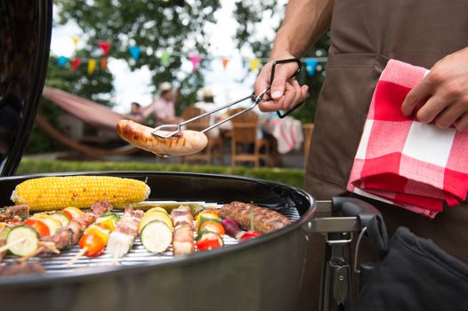Assorted delicious grilled meat with vegetable over the coals on a barbecue
