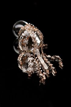Golden bracelets on a studio background