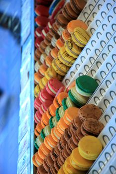 Stacked macarons on display in a store