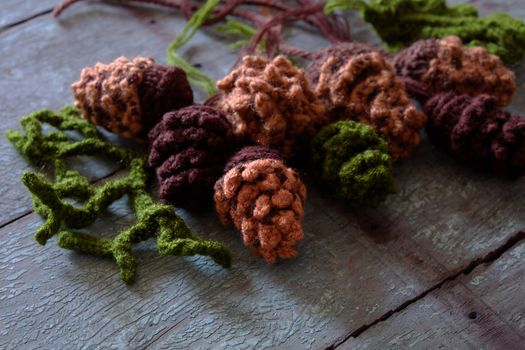 Group of knitted pinecone from brown yarn to decor for Xmas holiday, pine cone is popular Christmas ornament in wintertime