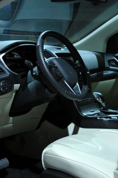 Modern car interior, luxurious materials in different shades of grey