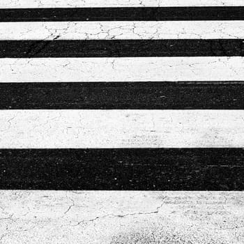 White painted pedestrian crossing on the road.