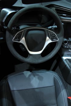 Modern car interior, luxurious materials in different shades of grey